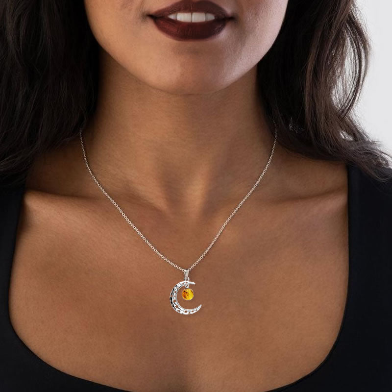 moon pendant with stars and amber